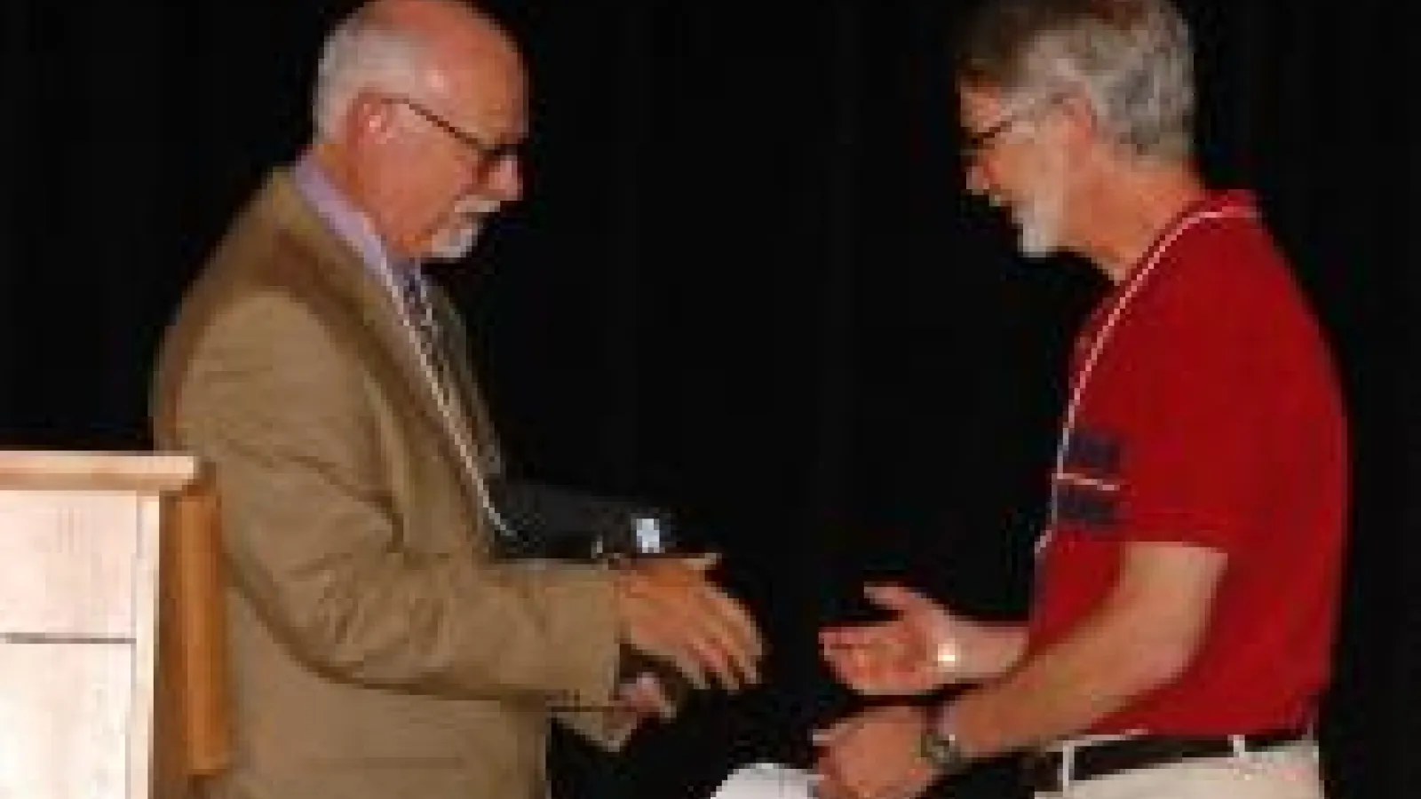 Dr. Shoenberg receving award