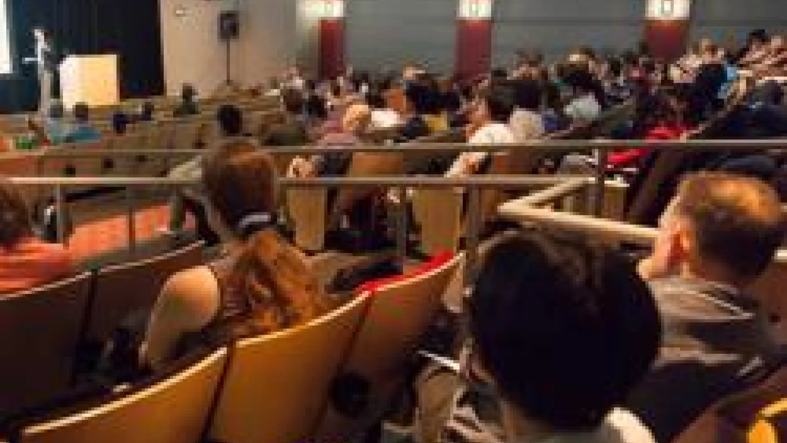 People watching the symposium