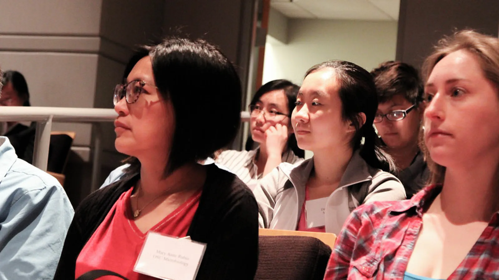 Picture of symposium participants watching a lecture