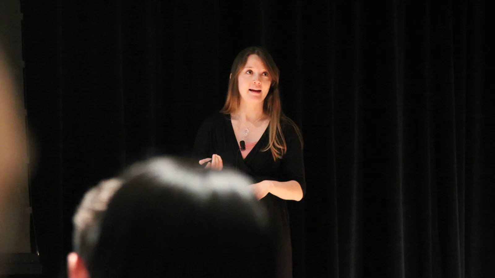 A student gives a talk at the annual symposium
