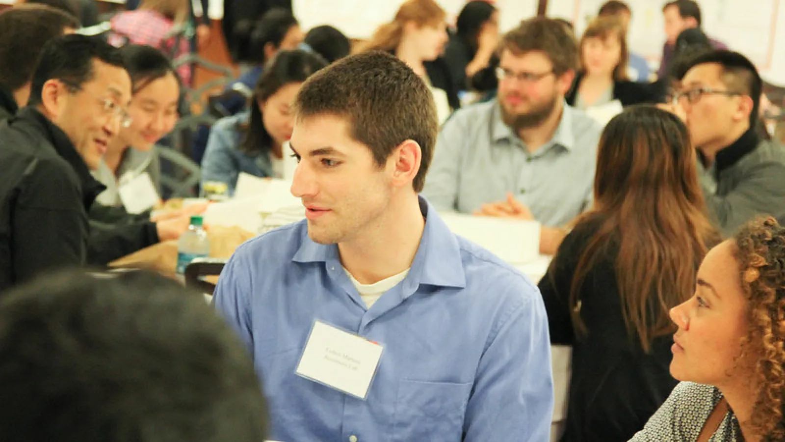 Symposium participants talking during lunch