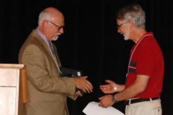 Dr. Shoenberg receving award
