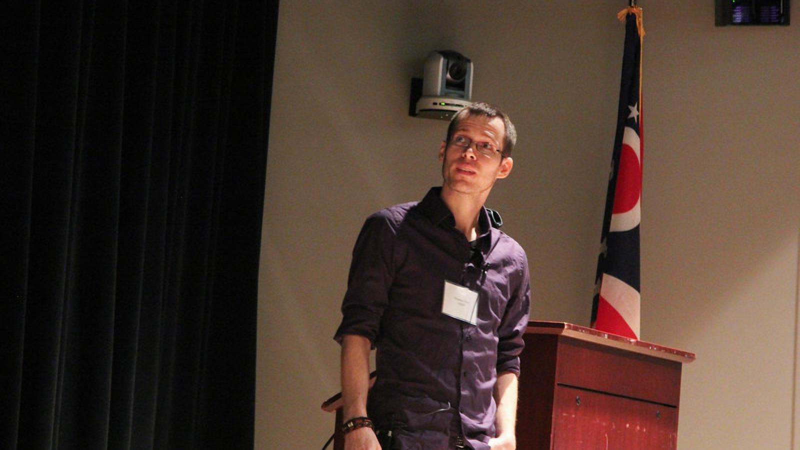 A student gives a talk at the annual symposium